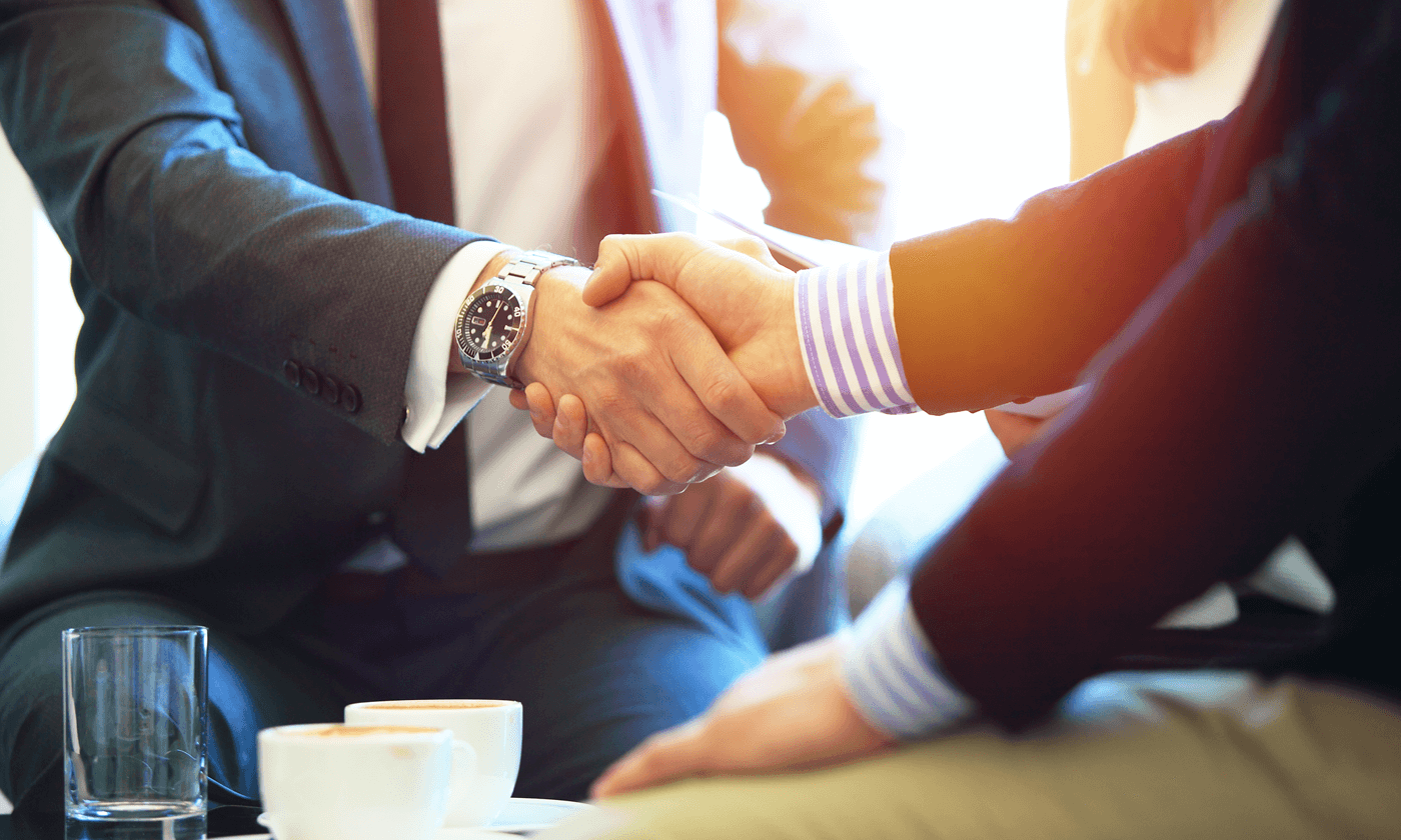 men in suit doing handshake