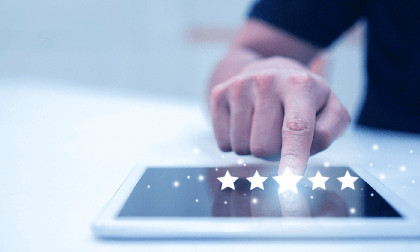 person pointing a finger on tablet, five stars