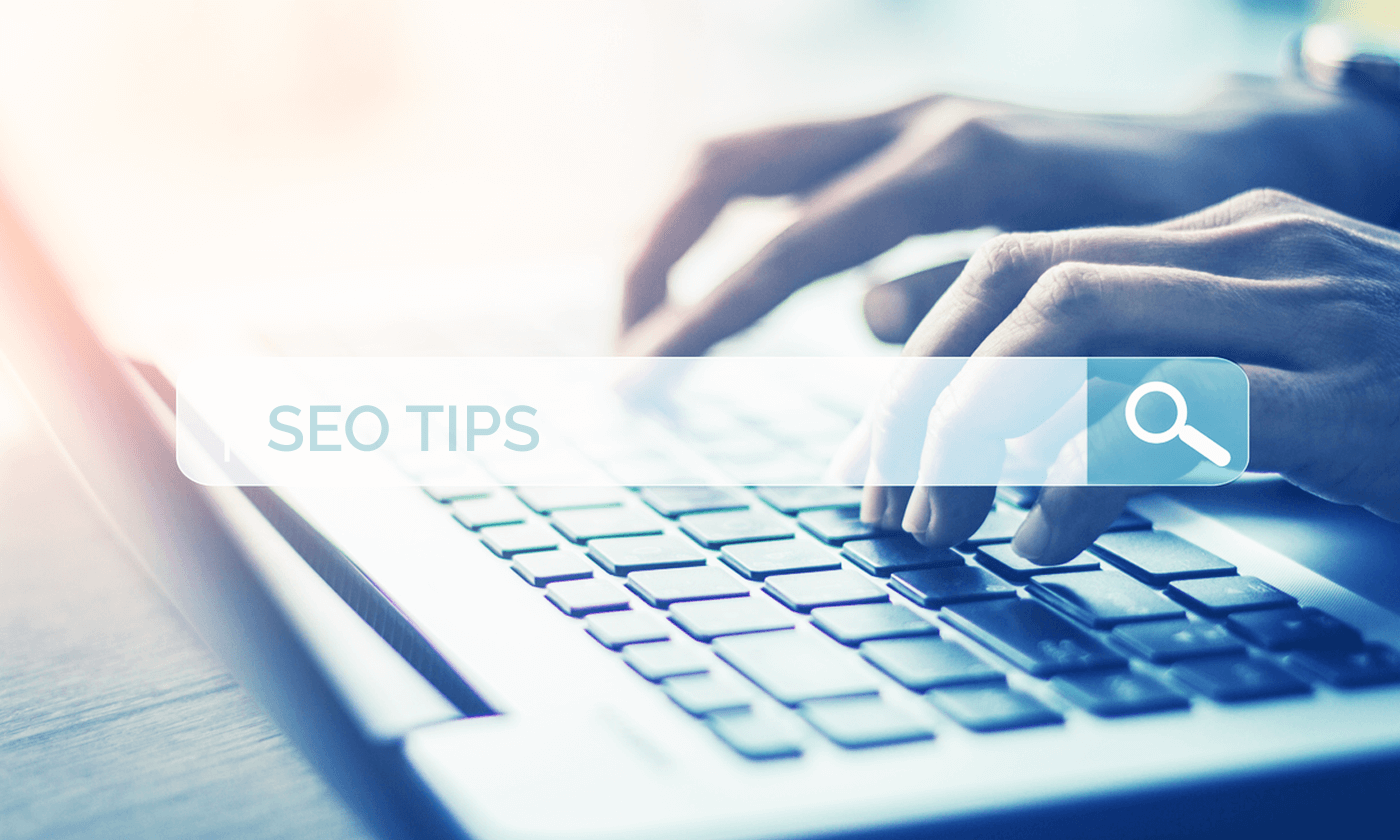 seo tips, typing on laptop
