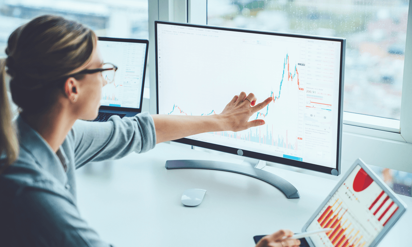 woman pointing on the stock chart