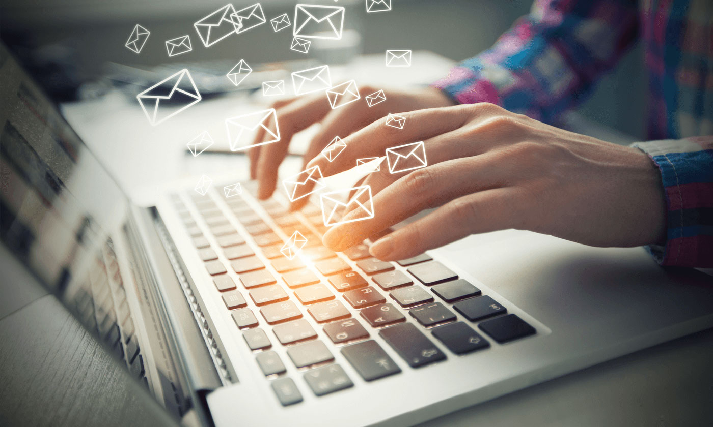 person typing on keyboard, email