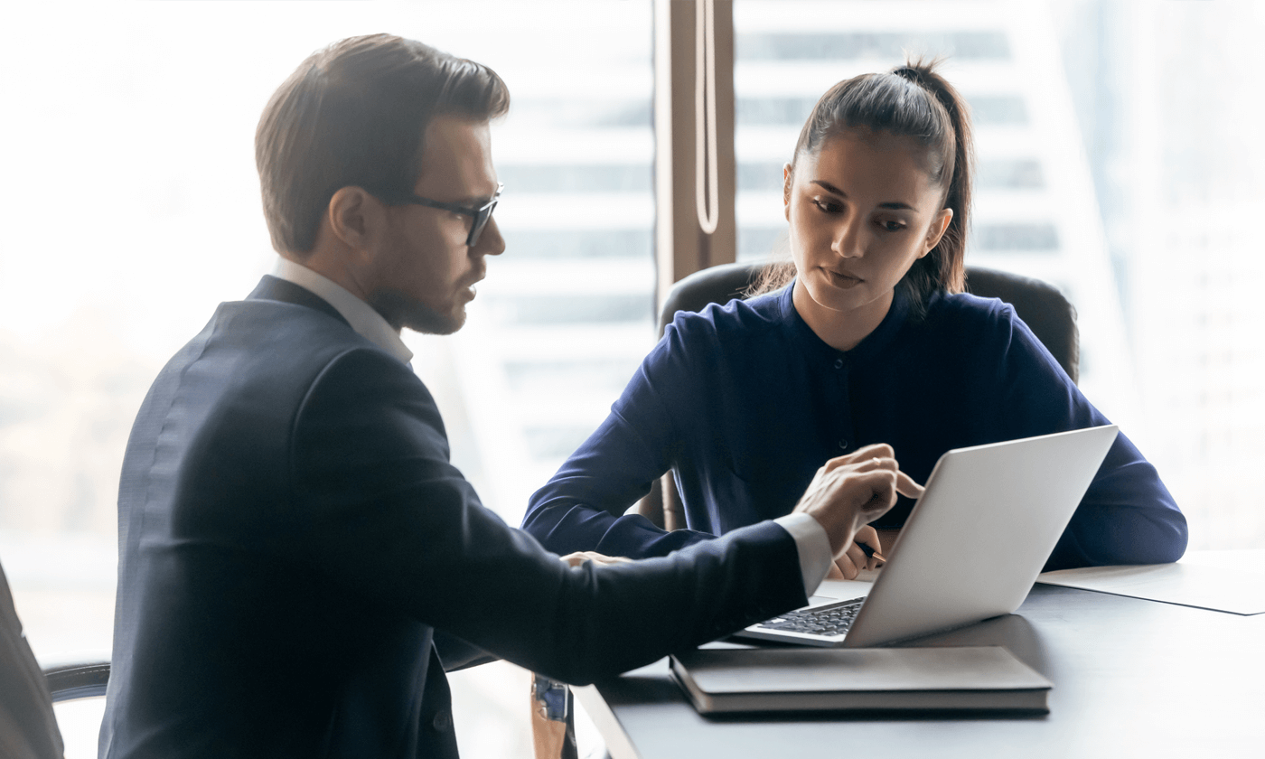 man showing something to a woman