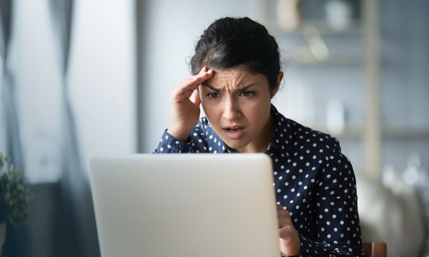 woman on a laptop stressing something