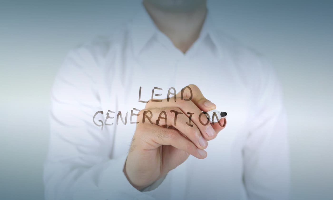 man writing lead generation on the glass board