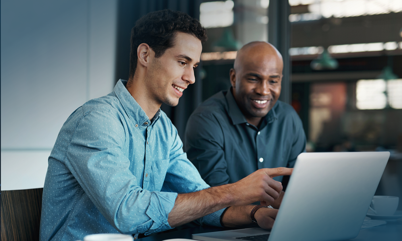 man explaining something to coworker