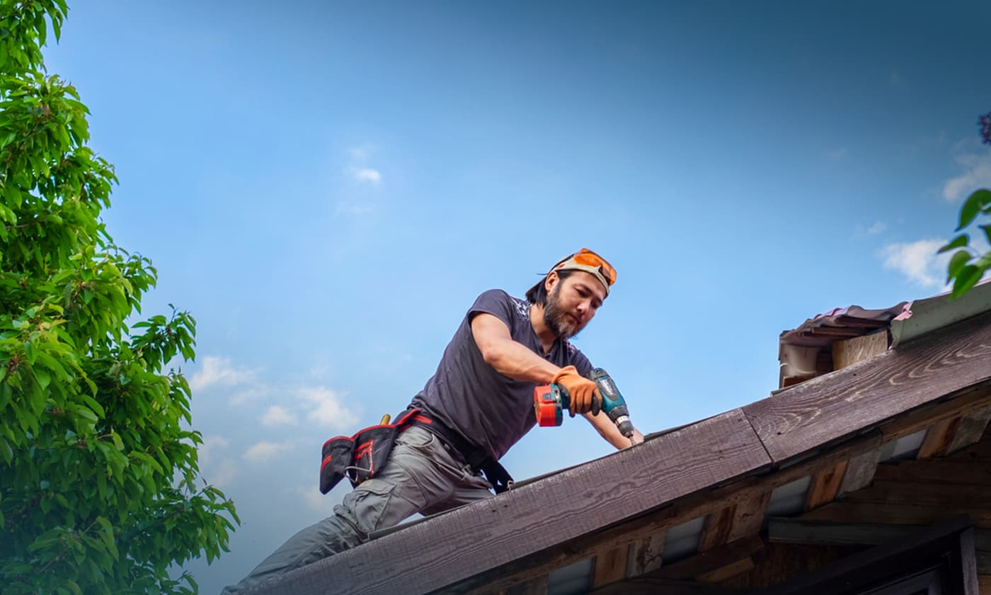 Man on roof working