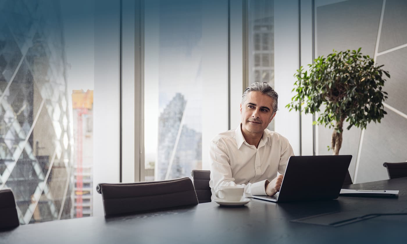 Man in conference room thinking