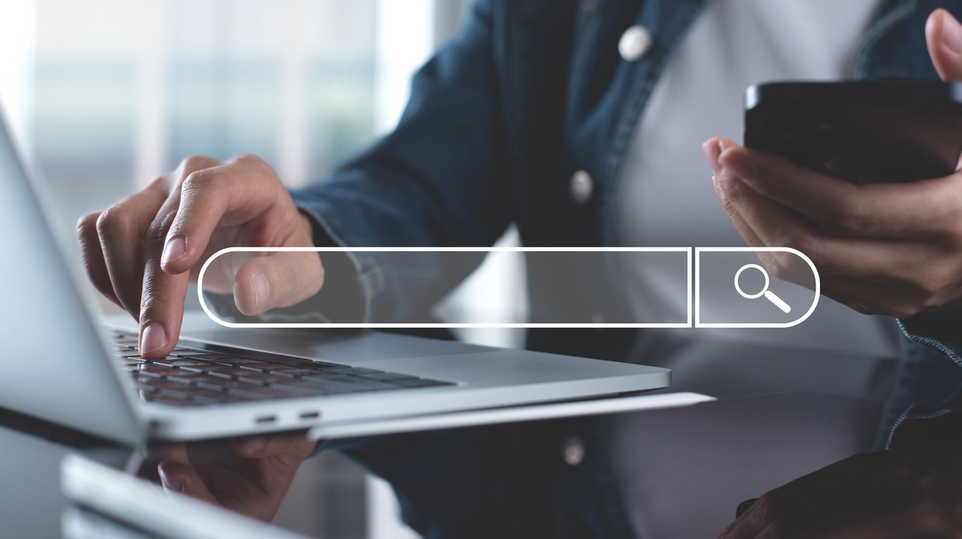 typing on laptop computer keyboard searching the information, internet browsing